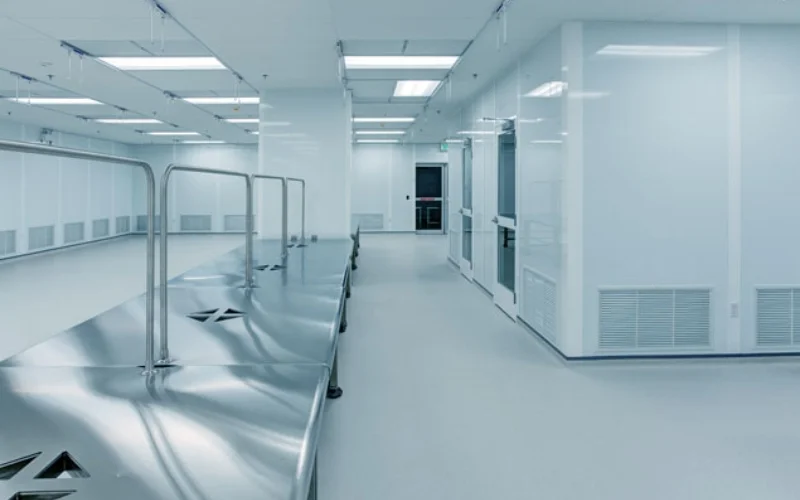 Technicians installing modular cleanroom walls